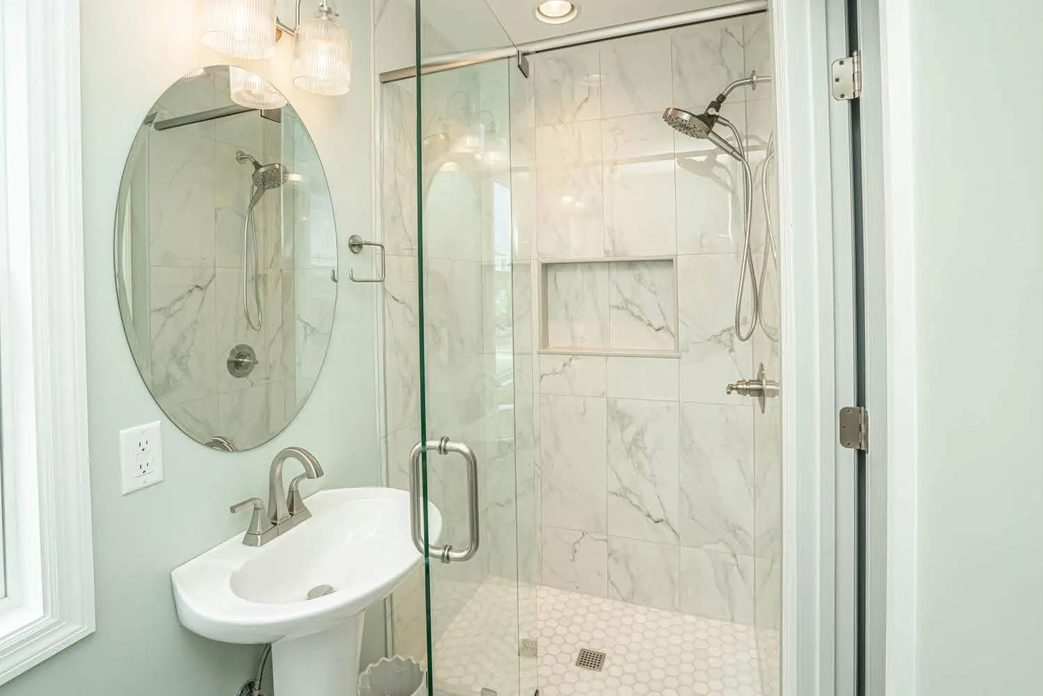 Marble shower and penny floor, guest bath