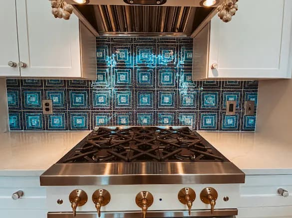 Mosaic backsplash behind the range